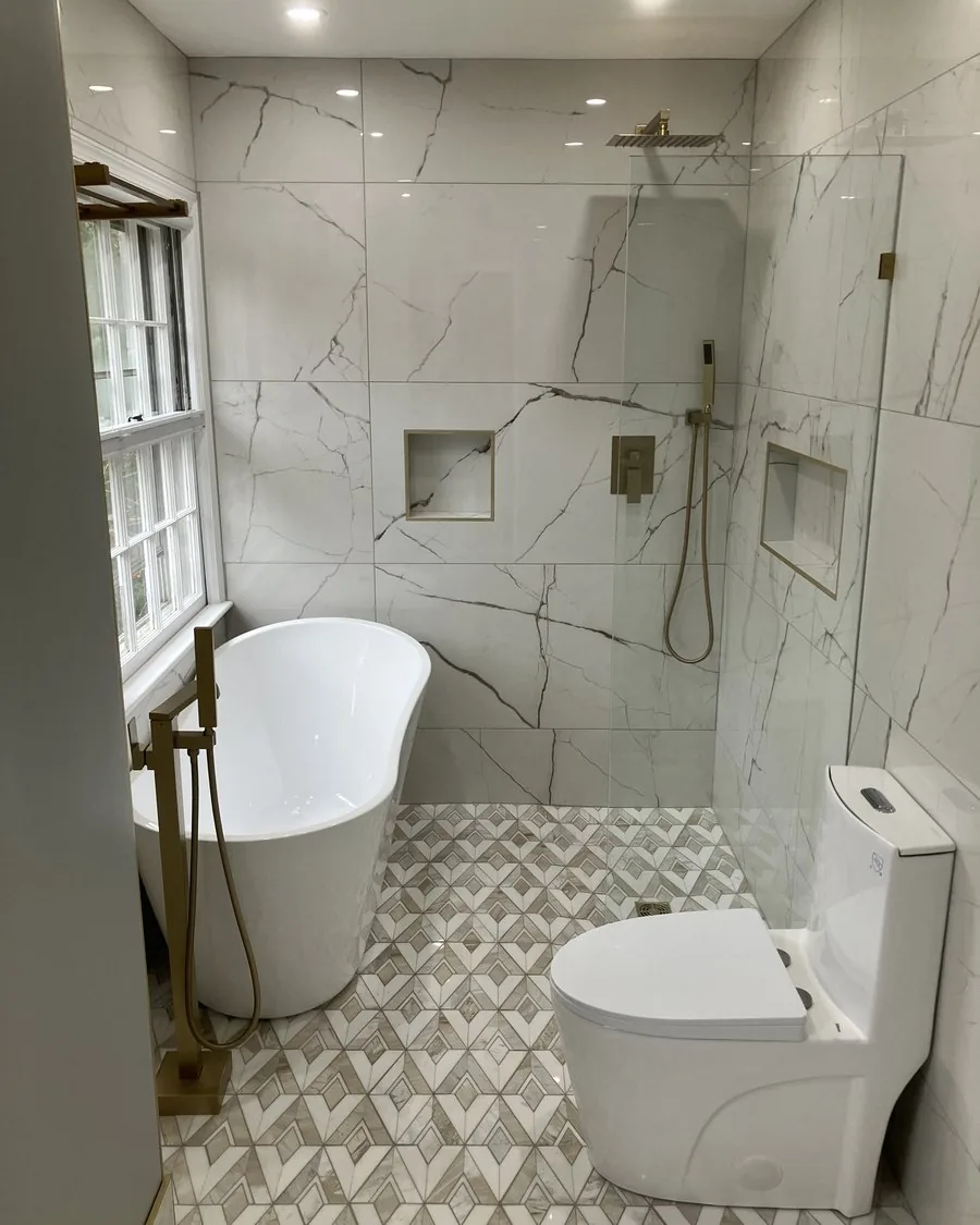 Bathroom with a tub, walk-in shower and mosaic floor