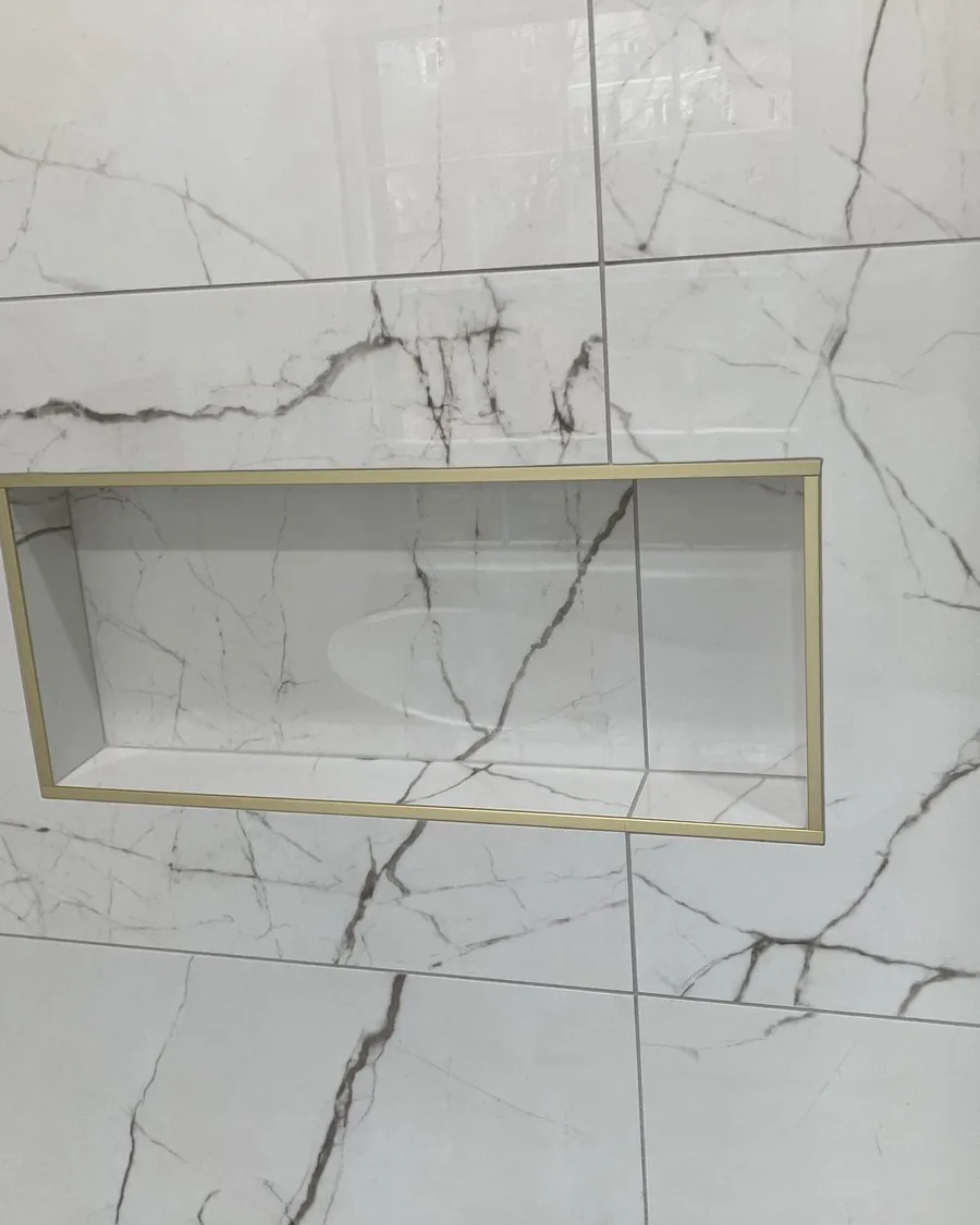Book matched marble shower niche