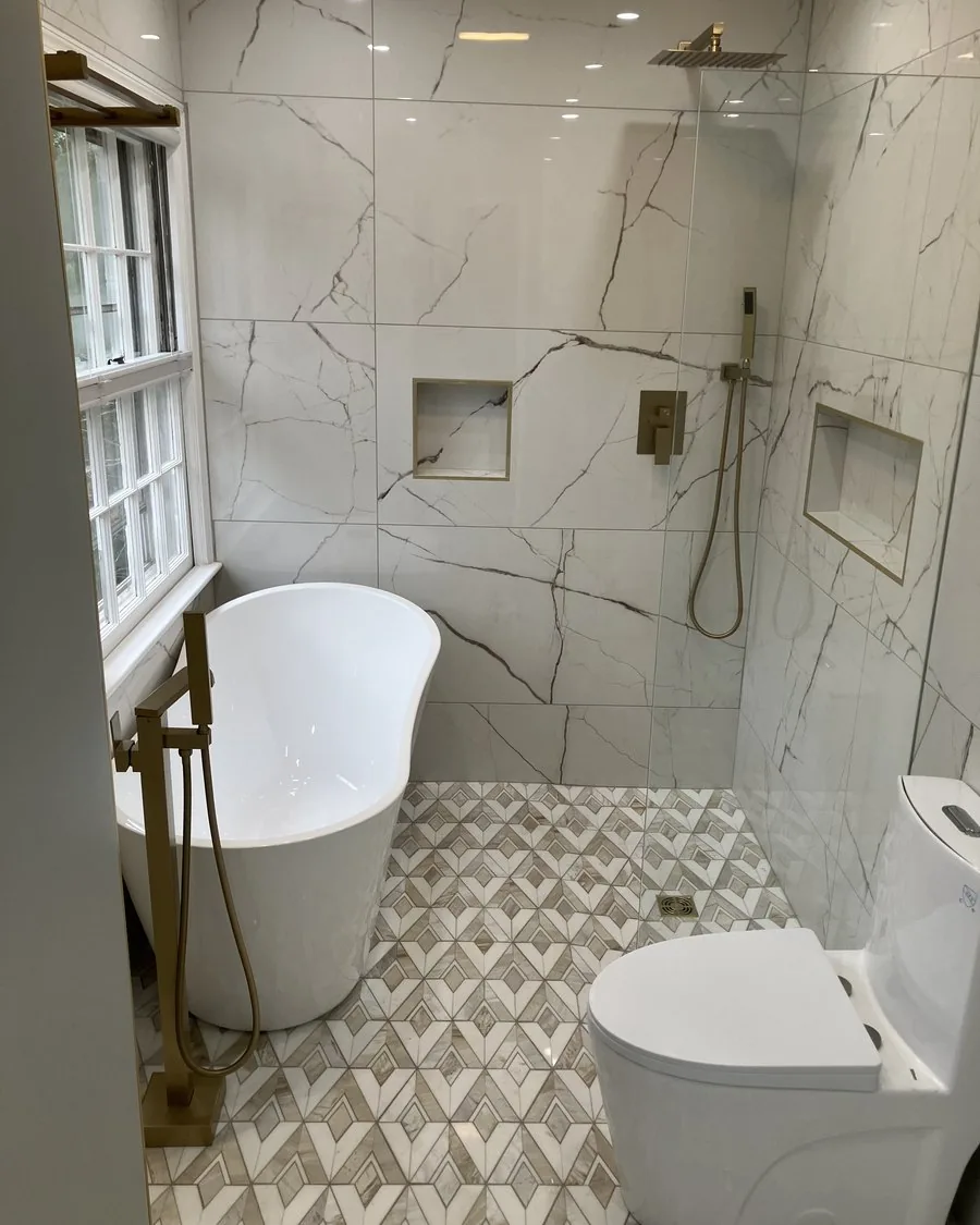 Marble bathroom with a walk-in shower and patterned floor tile