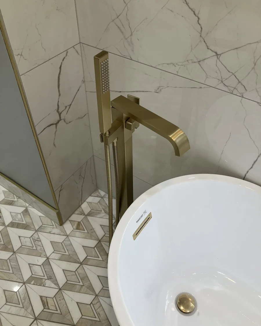 Brushed gold floor mounted tub filler